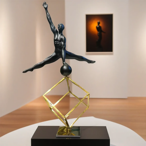 A man balancing on a football