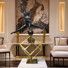 A man balancing on a football